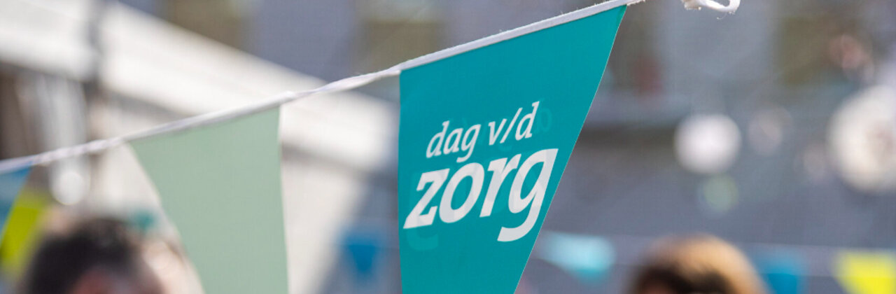 Een vlaggetje met dan van de zorg op