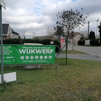 wijk met affiche van wijkwerf